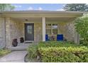 Inviting front porch with stone facade and cozy seating at 2315 Elm Swamp Rd, Lebanon, IN 46052