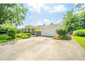 Ranch home with attached garage and colorful garden at 317 Stoner Dr, Anderson, IN 46013
