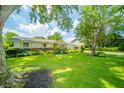 Charming one-story home with manicured lawn and garden beds at 317 Stoner Dr, Anderson, IN 46013