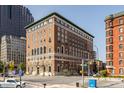 Brick building with arched windows in a bustling cityscape on a clear day at 350 N Meridian St # 606/607, Indianapolis, IN 46204