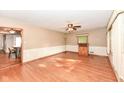 Spacious living room with hardwood floors, neutral walls, and ceiling fan at 3515 Lindenwald Dr, Indianapolis, IN 46217