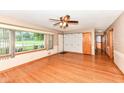 Inviting living room with hardwood floors and large windows overlooking the front yard at 3515 Lindenwald Dr, Indianapolis, IN 46217
