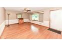 Bright living room features hardwood floors, fresh paint and large windows at 3515 Lindenwald Dr, Indianapolis, IN 46217