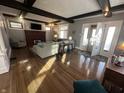 Spacious living room featuring hardwood floors, fireplace, and beamed ceilings at 4130 Rookwood Ave, Indianapolis, IN 46208