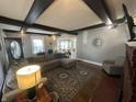 Inviting living room with comfortable seating, a fireplace, and plenty of natural light at 4130 Rookwood Ave, Indianapolis, IN 46208