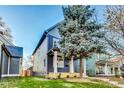 Charming two-story home with a landscaped yard and inviting porch at 430 N Keystone Ave, Indianapolis, IN 46201