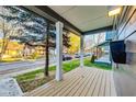 Inviting front porch with wood deck and view of the street at 430 N Keystone Ave, Indianapolis, IN 46201