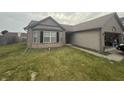 Attractive single-story house with brick and siding, complete with an attached two-car garage at 5954 Honeywell Dr, Indianapolis, IN 46236
