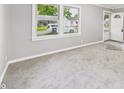 Spacious, freshly painted living room, featuring new carpeting at 602 W 34Th St, Anderson, IN 46013