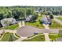 Stunning aerial view of the home nestled in a serene neighborhood with lush greenery at 6374 Timberbluff Cir, Avon, IN 46123