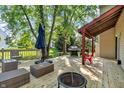 Spacious wooden deck featuring outdoor seating, a grill, and a cozy fire pit at 6374 Timberbluff Cir, Avon, IN 46123