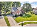 Beautiful two-story brick home with a three-car garage, on a large manicured lot at 6374 Timberbluff Cir, Avon, IN 46123