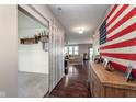 Foyer entrance features a sliding barn door and a view into the living room at 6664 Kara Ln, Brownsburg, IN 46112