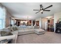 Spacious living room with comfortable seating, large windows, and open floor plan at 6664 Kara Ln, Brownsburg, IN 46112