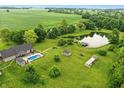 Beautiful land with a pool, pond, and various outbuildings, creating a private retreat at 750 N 500 W, Lebanon, IN 46052