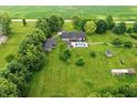 Expansive property with a pool and outbuildings, surrounded by a beautiful lawn and greenery at 750 N 500 W, Lebanon, IN 46052