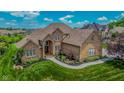 Stunning aerial view of brick home, highlighting its well-maintained landscaping and serene surroundings at 7845 Centerstone Ct, Indianapolis, IN 46259