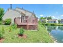 A backyard deck overlooks a peaceful waterfront area, perfect for outdoor relaxation and entertaining at 7846 Park North Cir, Indianapolis, IN 46260