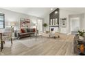 Spacious living area featuring a cozy fireplace, built-in shelving, and stylish furnishings at 7914 Trotwood Cir, Indianapolis, IN 46256
