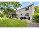The backyard features a screened in porch with room for seating and a patio area for grilling at 13470 Shakamac Dr, Carmel, IN 46032