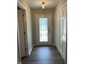 Bright foyer featuring wood-look floors, closet for storage, and a front door with decorative glass at 1540 Roanoke Dr, Zionsville, IN 46077