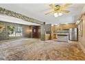 Open concept living room showcasing seamless flow to kitchen and front entry at 1841 Shady Ln, Martinsville, IN 46151