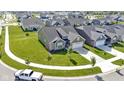 Aerial view of a house with a well-manicured lawn in a planned community at 19195 River Jordan Dr, Westfield, IN 46074