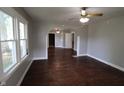Spacious living room featuring hardwood floors, neutral walls, and arched doorways that add architectural interest at 2025 Fairview St, Anderson, IN 46016