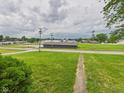 A serene view of a neighborhood with green space, captured from an elevated perspective of the property at 203 Plum E St, Frankton, IN 46044