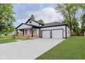 A well-manicured lawn and updated landscaping surround this delightful exterior at 2125 N Pasadena St, Indianapolis, IN 46219