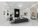 An inviting living room featuring a modern fireplace and recessed lighting at 2125 N Pasadena St, Indianapolis, IN 46219