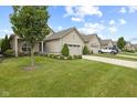 Street view of houses with two-car garages and manicured lawns on a sunny day at 2246 Heather Glen Way, Franklin, IN 46131