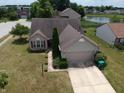 Beautiful home with a well-kept yard and neighborhood pond view, conveniently located at 291 Lakemoore St, Brownsburg, IN 46112