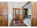 Inviting entryway boasts a tile floor and natural light shining through the front door's window at 450 W 250 N, Lebanon, IN 46052