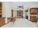 Spacious living room featuring a brick fireplace, and access to the backyard at 450 W 250 N, Lebanon, IN 46052