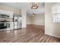 Open-concept kitchen with stainless steel appliances flows into a spacious living area at 452 Southern Pines Dr, Whiteland, IN 46184