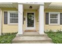 Close-up of the home's inviting front entrance, complete with charming details at 5715 Oak Ave, Indianapolis, IN 46219