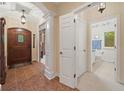 Welcoming foyer with tile flooring, decorative archway, and view to the bathroom and secondary living space at 6733 Jons, Zionsville, IN 46077
