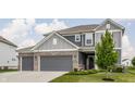 Attractive two-story home boasting a well-maintained lawn and a convenient two-car attached garage at 6902 Diamondleaf Way, Brownsburg, IN 46112