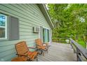 Relaxing deck area featuring comfortable seating, perfect for enjoying the outdoors with a view at 8842 S Pleasure Valley Rd, Waldron, IN 46182