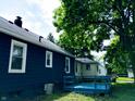 The exterior showcases a well-maintained backyard, offering a private outdoor retreat at 94 N Routiers Ave, Indianapolis, IN 46219