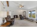 Spacious living room with vaulted ceilings, ceiling fan, and lots of natural light at 1016 W Creek Ridge Dr, Fountaintown, IN 46130