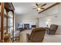 Cozy living room features vaulted ceilings, brick fireplace, ceiling fan, and comfortable seating at 1016 W Creek Ridge Dr, Fountaintown, IN 46130