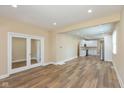 Bright living room boasts fresh paint, recessed lights, new floors, and opens to the modern, remodeled kitchen at 1122 W 35Th St, Indianapolis, IN 46208
