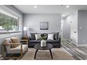 Cozy living room with a comfortable sofa, stylish decor, and a window providing natural light at 1346 Carroll White Dr, Indianapolis, IN 46219