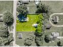 Aerial view of a property with a well-manicured lawn, house, and outbuilding at 1511 E 20Th St, Muncie, IN 47302