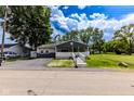 Inviting single-story house featuring a covered porch and well-maintained front yard at 1511 E 20Th St, Muncie, IN 47302