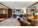 Bright living room boasts stylish decor, large windows, and an inviting sitting area at 160 Scranton Ct, Zionsville, IN 46077