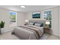 Cozy bedroom with a large bed, side tables, contemporary decor, and large windows offering ample natural light at 2001 S Jefferson St, Muncie, IN 47302