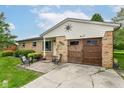 Inviting home with charming front patio, mature landscaping and warm curb appeal at 26858 State Road 19, Arcadia, IN 46030